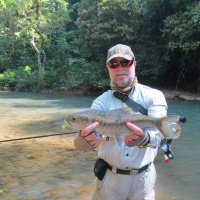 Spooky Mahseer on fly with Meik in central Thailand